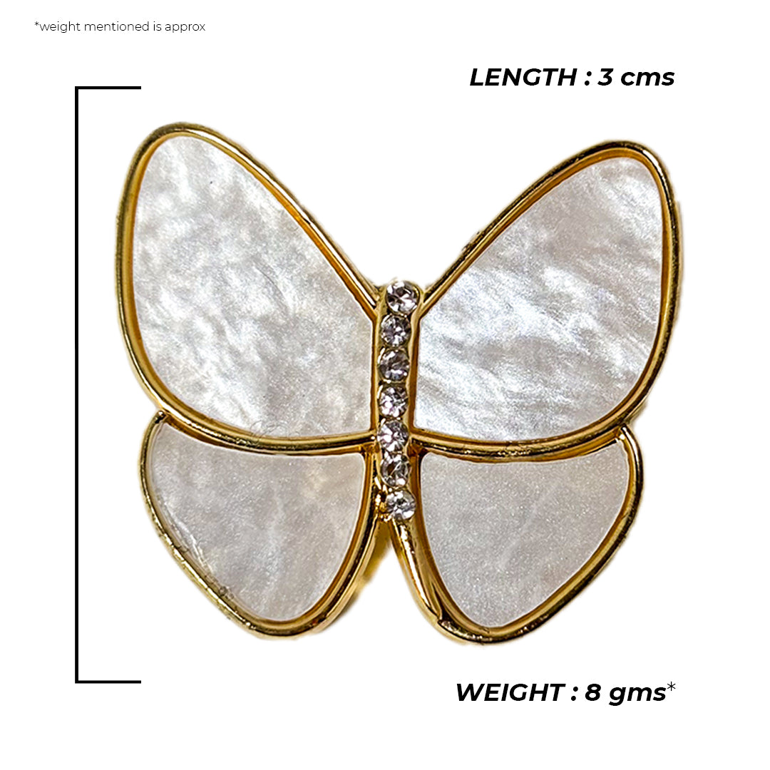 Close-up of a silver Urvi Saree Pin with intricate floral and leaf detailing, shimmering elegantly.