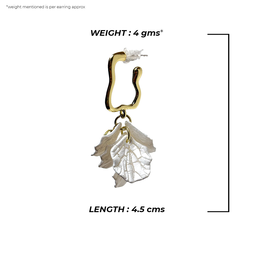 Camia Earrings: Delicate gold hoops with a small pearl drop, shown on a white background.
