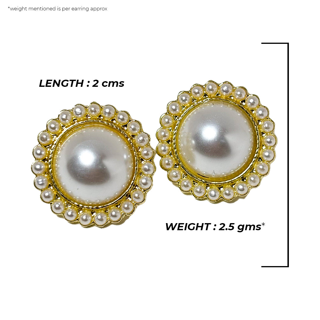 Close-up of the Misha Earrings, featuring delicate gold hoops with small, shimmering pearl drops.