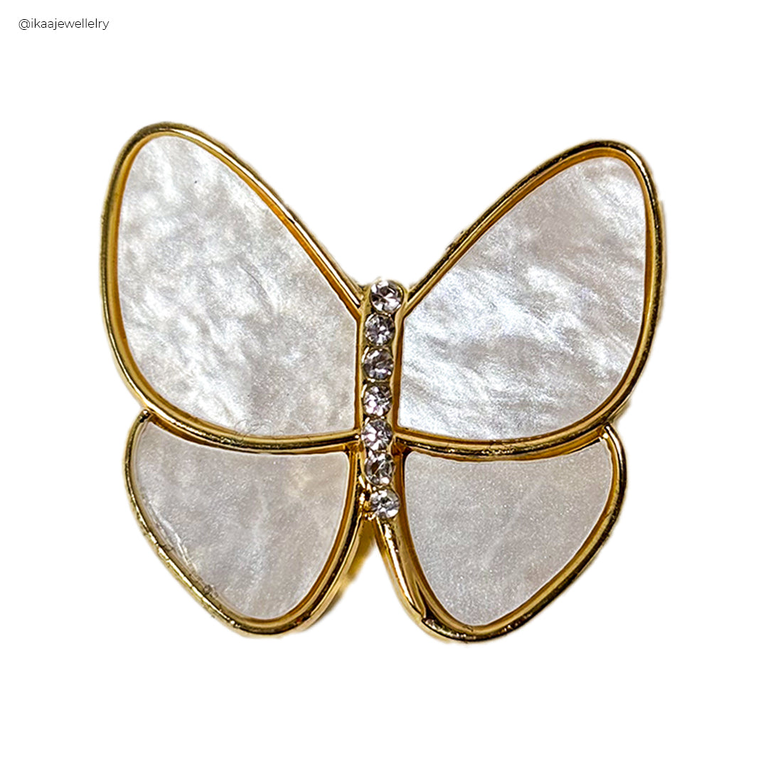 Close-up of the Urvi Saree Pin, showcasing intricate pearl and gold beadwork on a silver pin.