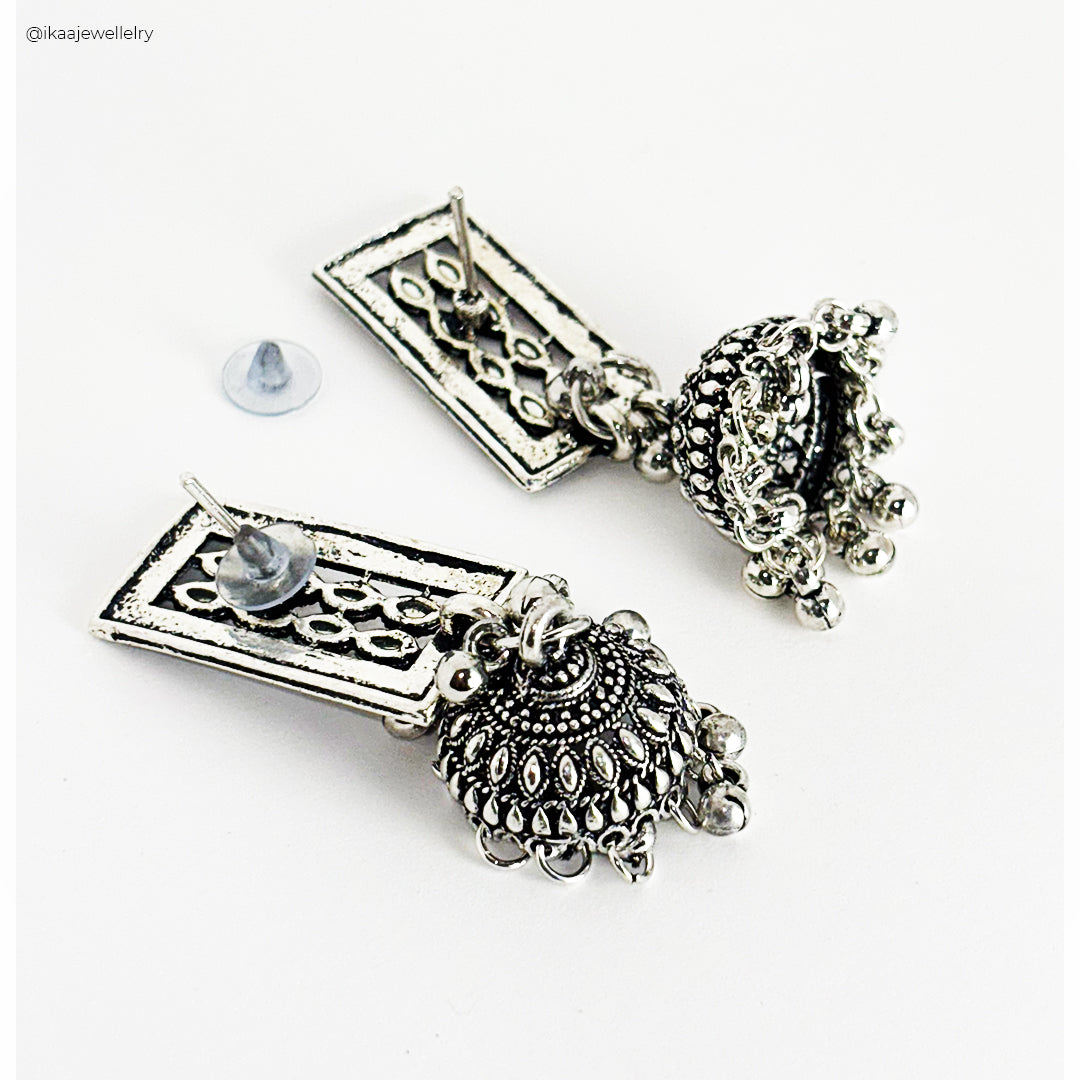 Aruna Jhumki Earrings, intricately designed gold-toned bell-shaped earrings with delicate pearl drops.