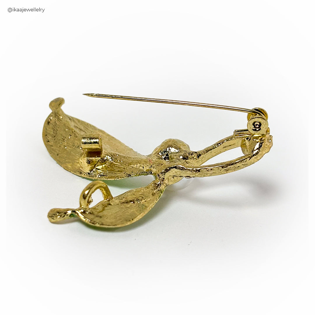 Elegant Anika Saree Pin with intricate floral design and delicate pearl accents.