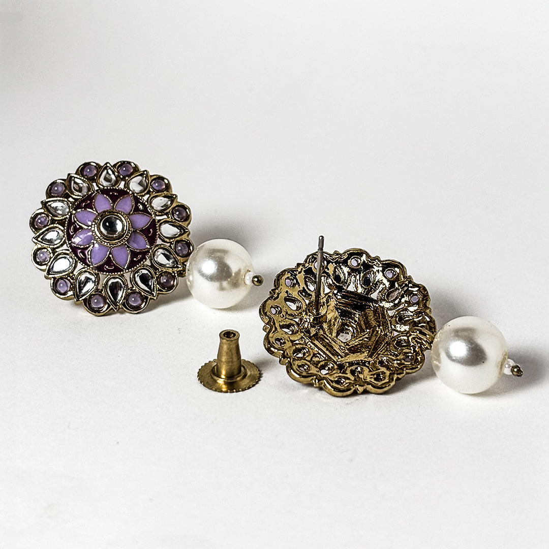 Juhi Pearl Drop Earrings: Elegant silver drop earrings featuring a single, luminous pearl suspended from a delicate chain.