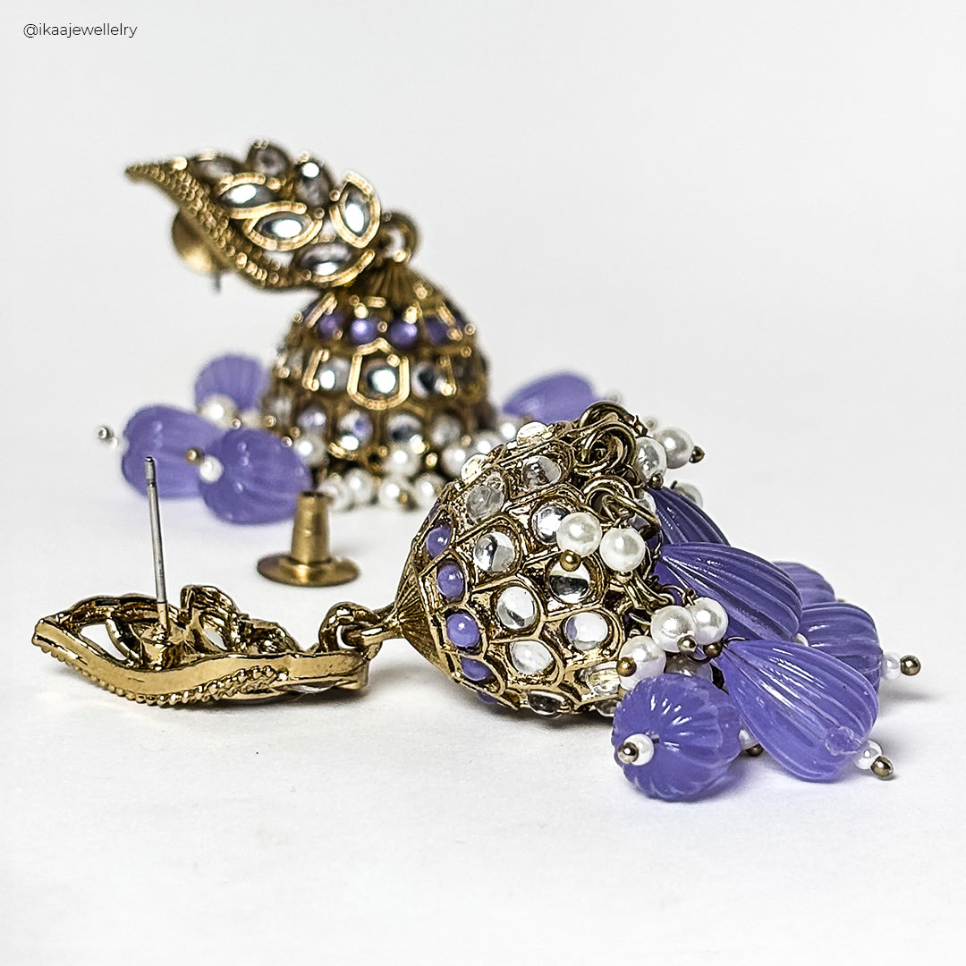 Malati Jhumka Earrings: Intricately crafted gold-toned jhumkas with a bell-shaped design and delicate pearl accents.