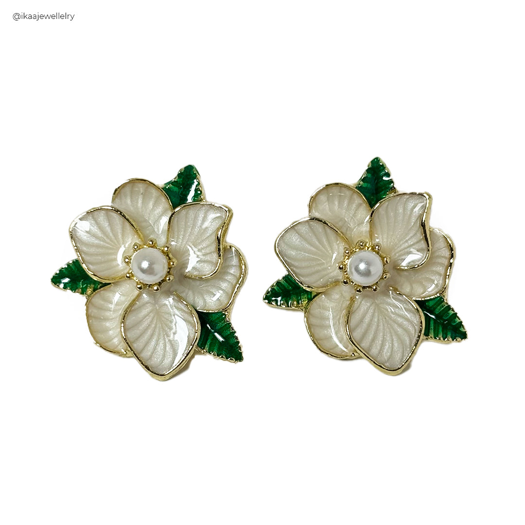 Roselle Ceramic Look Earrings, featuring a pair of textured, off-white oval drop earrings with a subtle sheen.