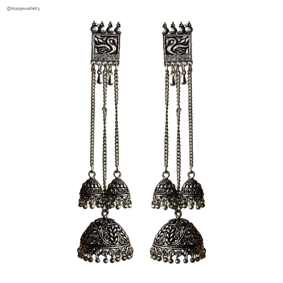 Chitra Long Earrings: Delicate gold-toned dangly earrings with intricate floral detailing and pearl accents.