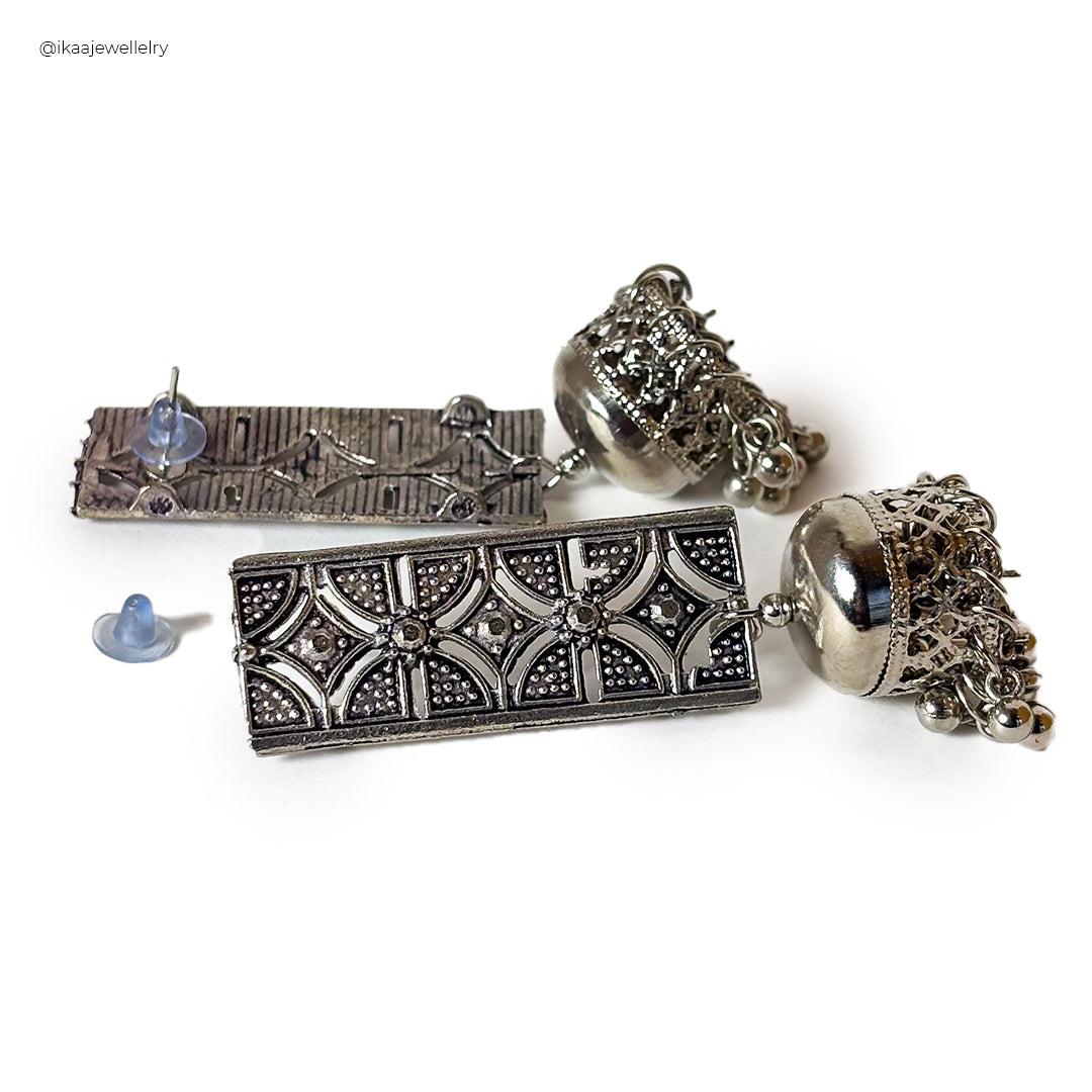 Close-up of Janhavi Earrings: delicate gold studs with intricate pearl detailing, perfect for everyday elegance.