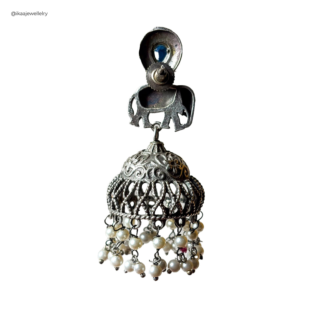 Close-up of the Saumya Earrings, featuring intricate silver floral designs with sparkling cubic zirconia stones.