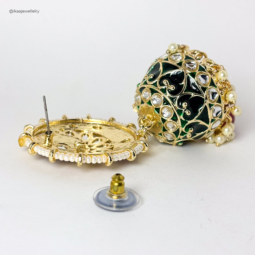 Zinia Jhumki Earring: ornate gold-tone jhumka earrings with intricate floral and bead details.