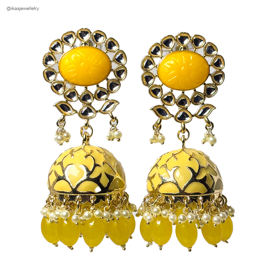 Meira Jhumka earrings, intricately designed gold-toned bell-shaped earrings with delicate pearl accents and dangling beads.