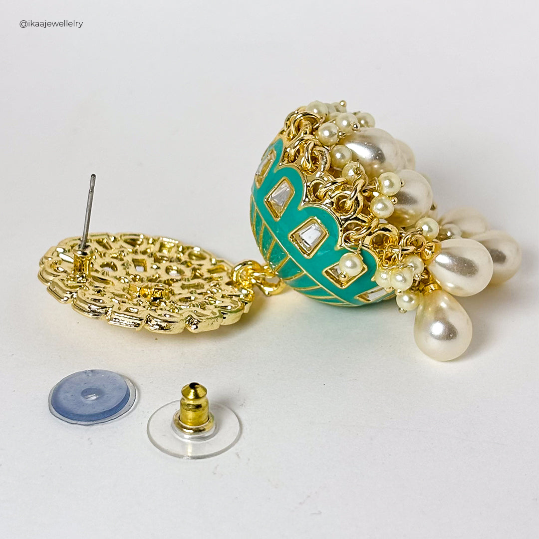 Aaria Jhumki Earrings: Close-up of intricate gold-toned jhumki earrings with pearl drops and delicate filigree work.