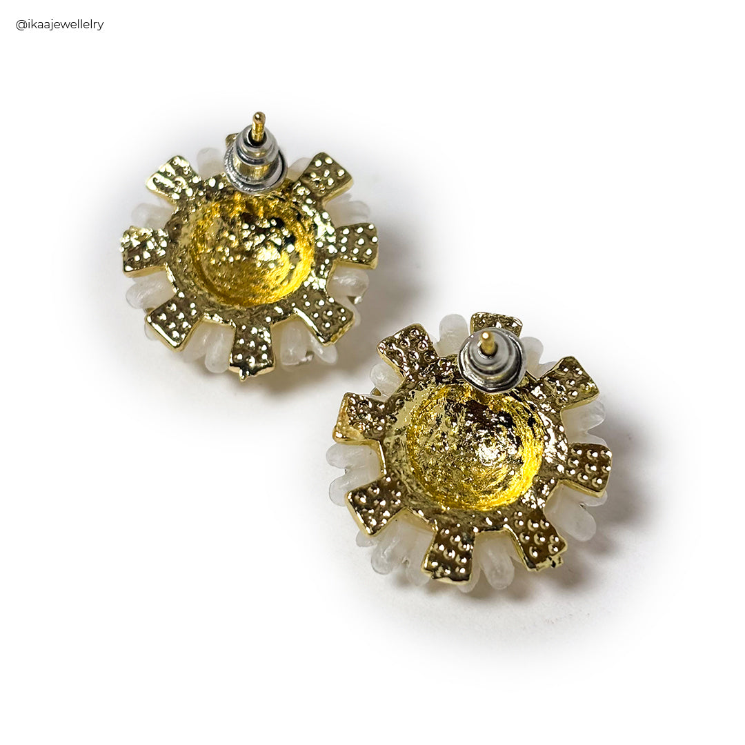 Close-up of Gulshan Earrings featuring intricate gold filigree and a central blue gemstone, showcasing fine craftsmanship.
