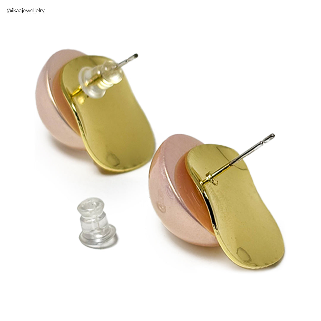 Elegant Nuva Earrings with intricate gold detailing on a white background, showcasing their delicate design.
