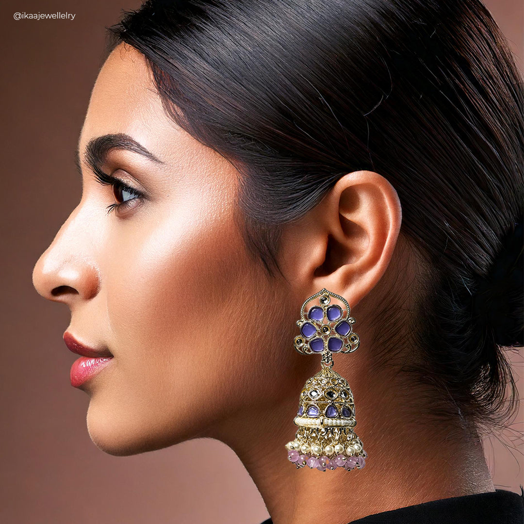 Pallavi Jhumka Earrings: intricately detailed gold-toned jhumka earrings with pearl accents, displayed against a white