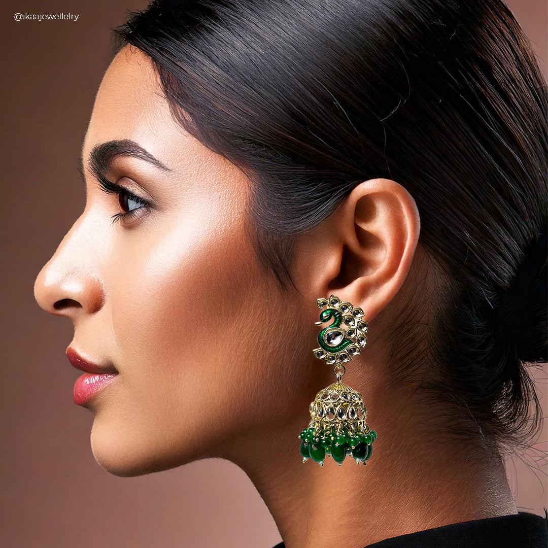 Morini Jhumki Earrings: detailed close-up of ornate gold-toned Indian drop earrings with intricate patterns and pearl
